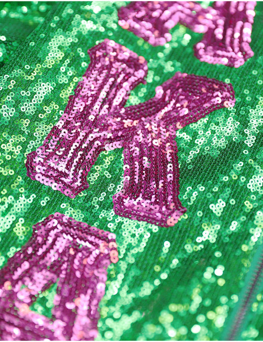 "Closeup of Alpha Kappa Alpha (AKA) Greek letters in pink and green, showcasing sorority pride and iconic symbols."