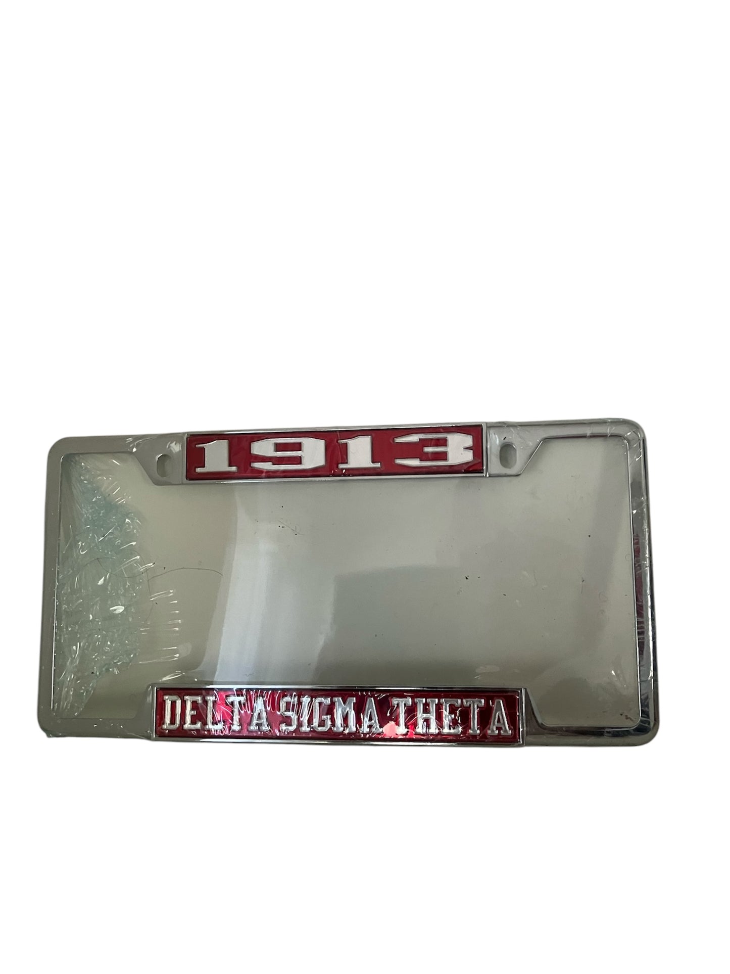Alt Text: Red fiberglass license plate frame with "1913" at the top and "Delta Sigma Theta Sorority" in white at the bottom.