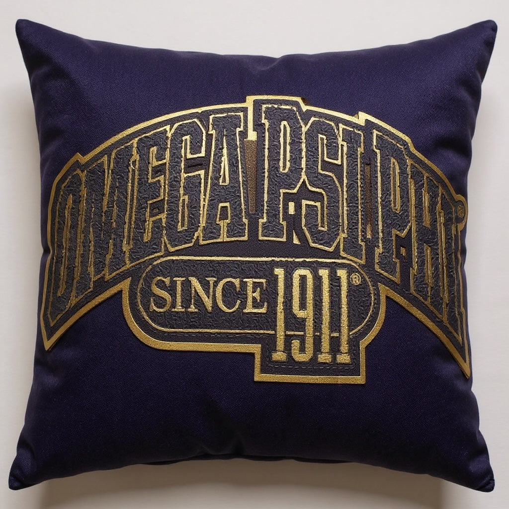 Purple pillow with Purple & gold Omega Psi Phi fraternity patch on a white background