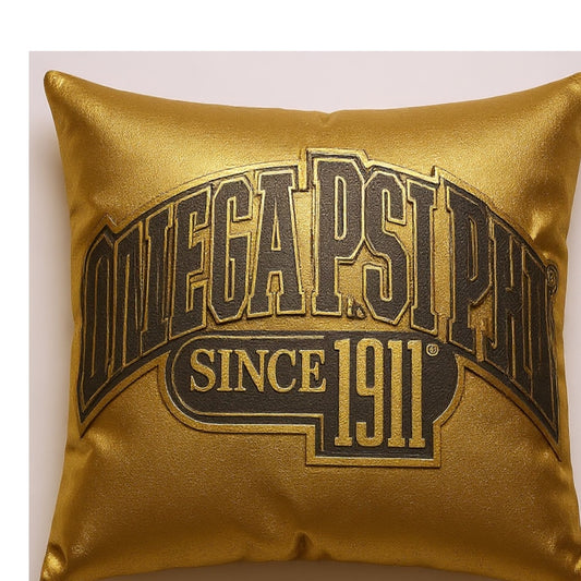 Gold pillow with 'Omega Psi Phi' Patch on a white background