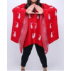 Woman wearing the Delta Sigma Theta Fortitude poncho shawl making the Delta hand sign