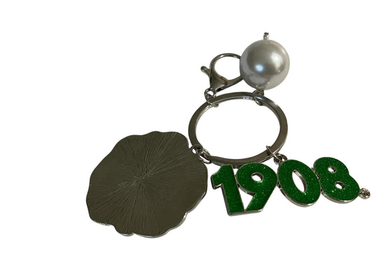 Silver AKA sorority keychain with pink enamel flower, green 1908 charm, and white pearl accent.