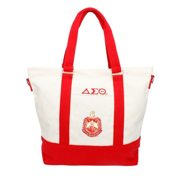 White tote bag with red accents featuring the Delta Crest on a white background