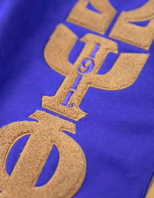 Omega Psi Phi Fraternity Cardigan - Closeup of Chenille Greek Letters and founding year