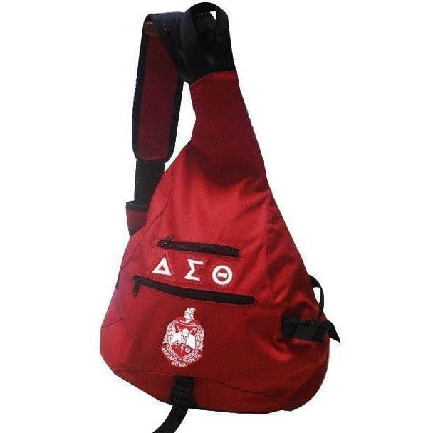 A red Delta Sigma Theta sling bag with the sorority's emblem and letters printed on the front.