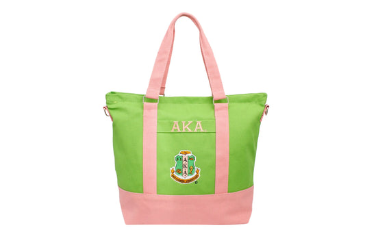 A stylish green tote bag with pink trim, featuring an embroidered Alpha Kappa Alpha shield and
Click image to set focal point



 Greek letters