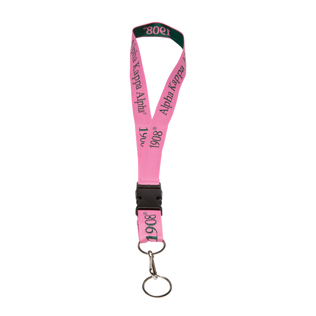An Alpha Kappa Alpha lanyard in their signature pink color, featuring the sorority's name and founding year.