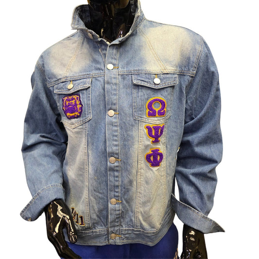 Denim jacket with purple & gold fraternity greek symbols on a white background