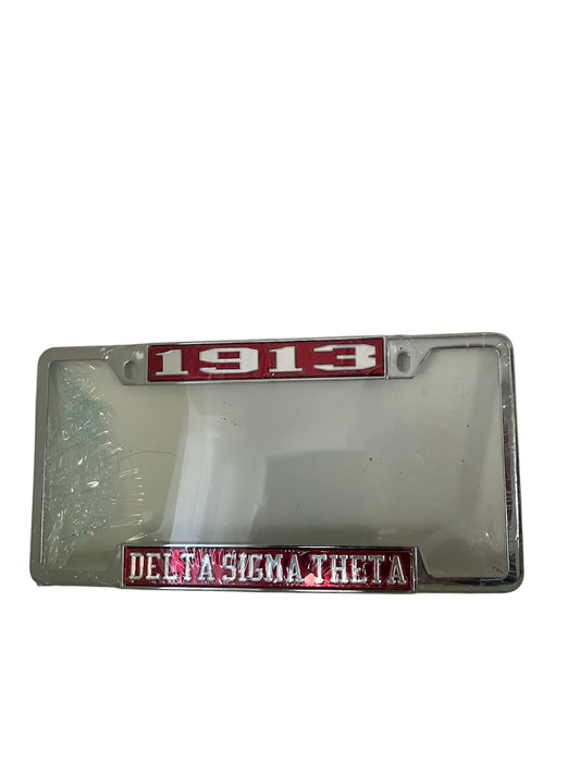 Alt Text: Red fiberglass license plate frame with "1913" at the top and "Delta Sigma Theta Sorority" in white at the bottom.