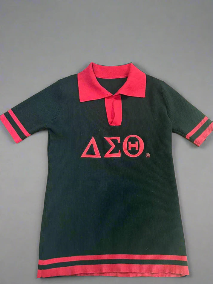 Black ribbed knit polo shirt featuring red Delta Sigma Theta (ΔΣΘ) Greek letters, a red collar, and striped cuffs and hem. 