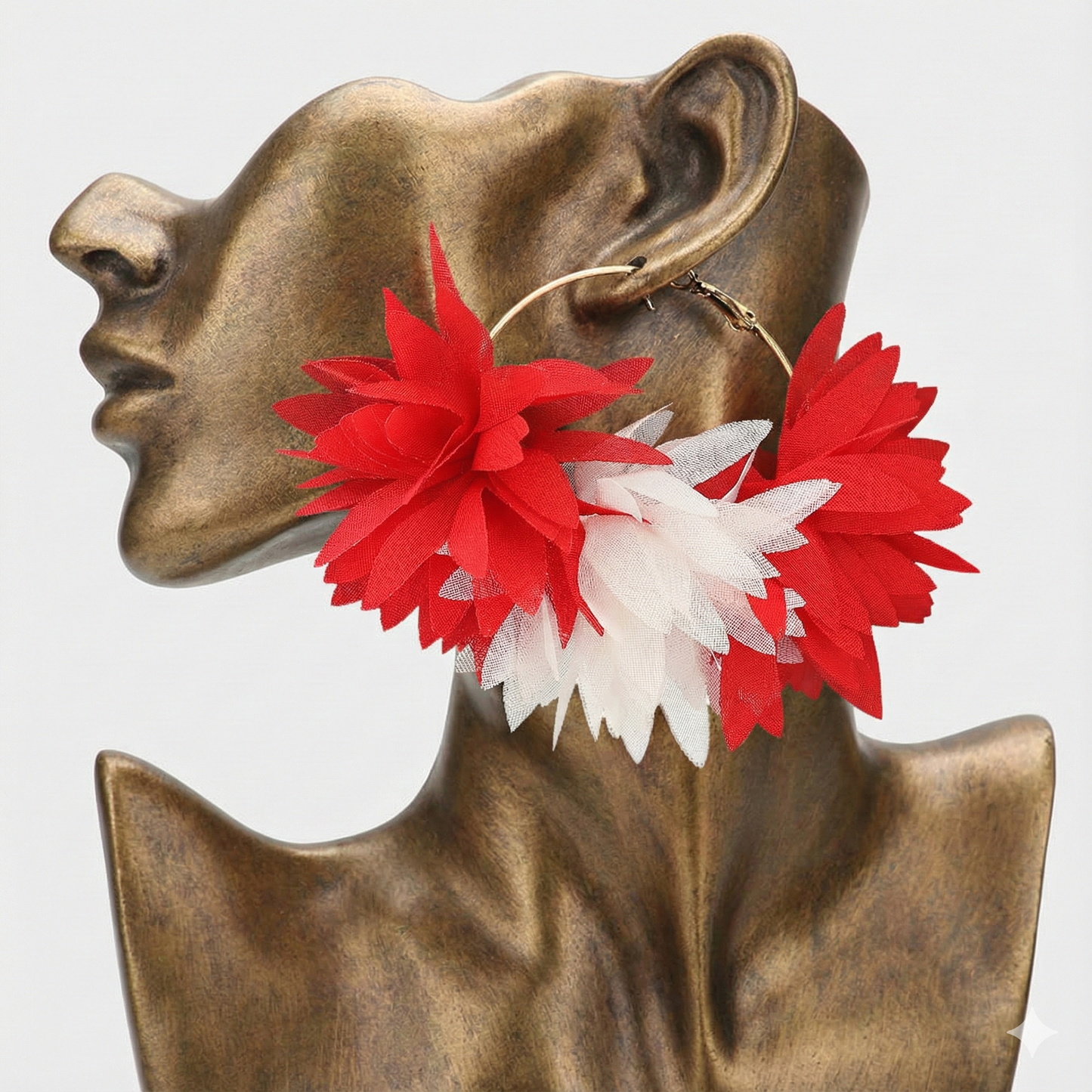 Artistic illustration of a bronze partial face sculpture wearing bold red and white flower statement earrings, set against a whimsical nature background.