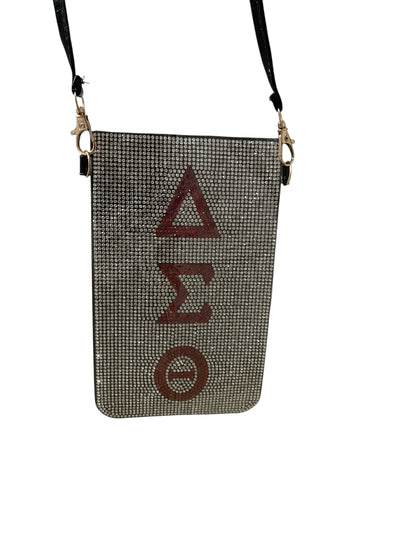 Crossbody bag with Delta Sigma Theta symbols on a white background