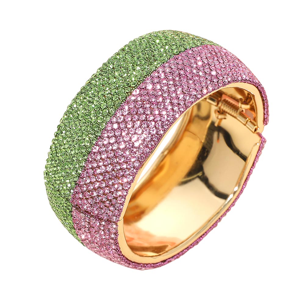Wide hinged gold bangle bracelet with two-tone pink and green crystal pave rhinestones.