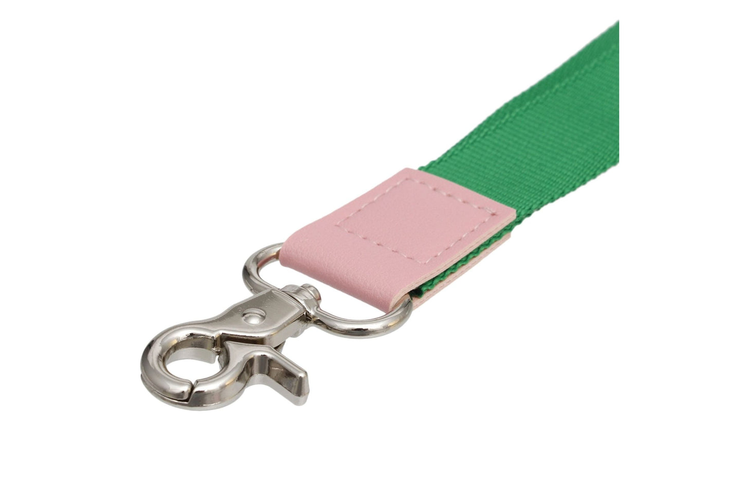 Close up of Green and pink lanyard with a metal clip on a white background
