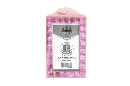 Pink rhinestone clutch with Alpha Kappa Alpha crest  on a white background