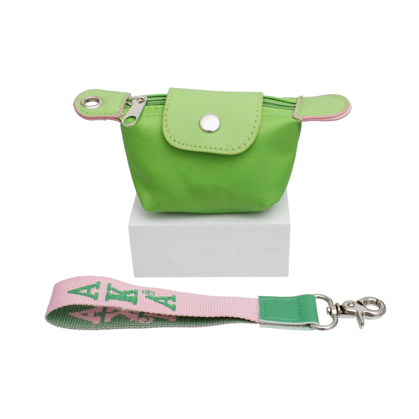 Green pouch with pink strap featurin AKA Greek Letters on a white background
