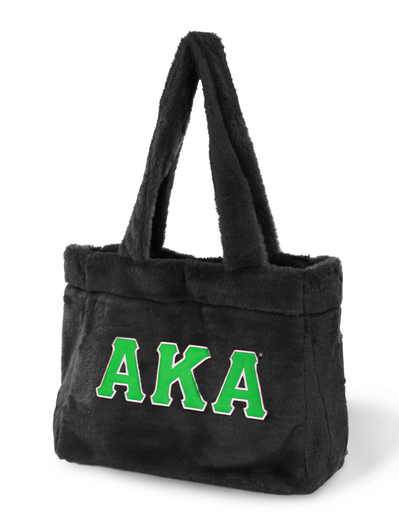 A stylish black tote bag featuring the Alpha Kappa Alpha sorority letters in bold tackle twill.