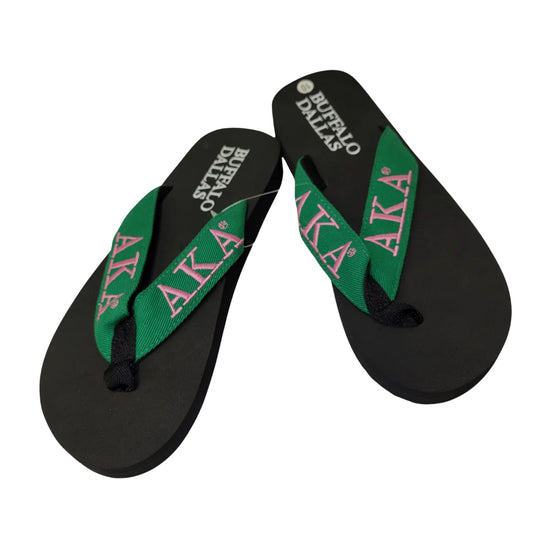 create 3 alt text
Here are three SEO-optimized alt text options for your AKA flip flops product image:

"Pink and green AKA sorority flip flops with Greek letters, featuring cushioned footbed and non-slip soles" (Focuses on colors, branding, and key features)

