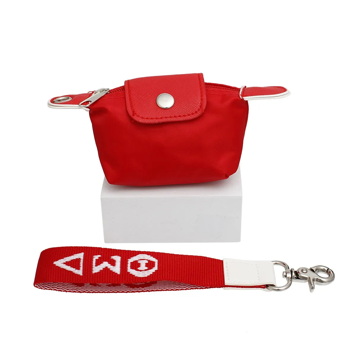 Delta Sigma Theta red nylon wristlet with snap flap, zipper, and "ΔΣΘ" embroidered strap.