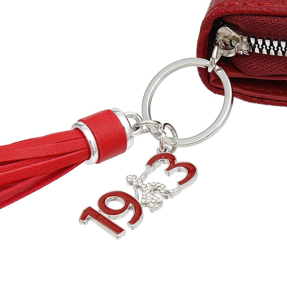 Close up of Red keychain with the Sorority's founding year and tassel on a white background