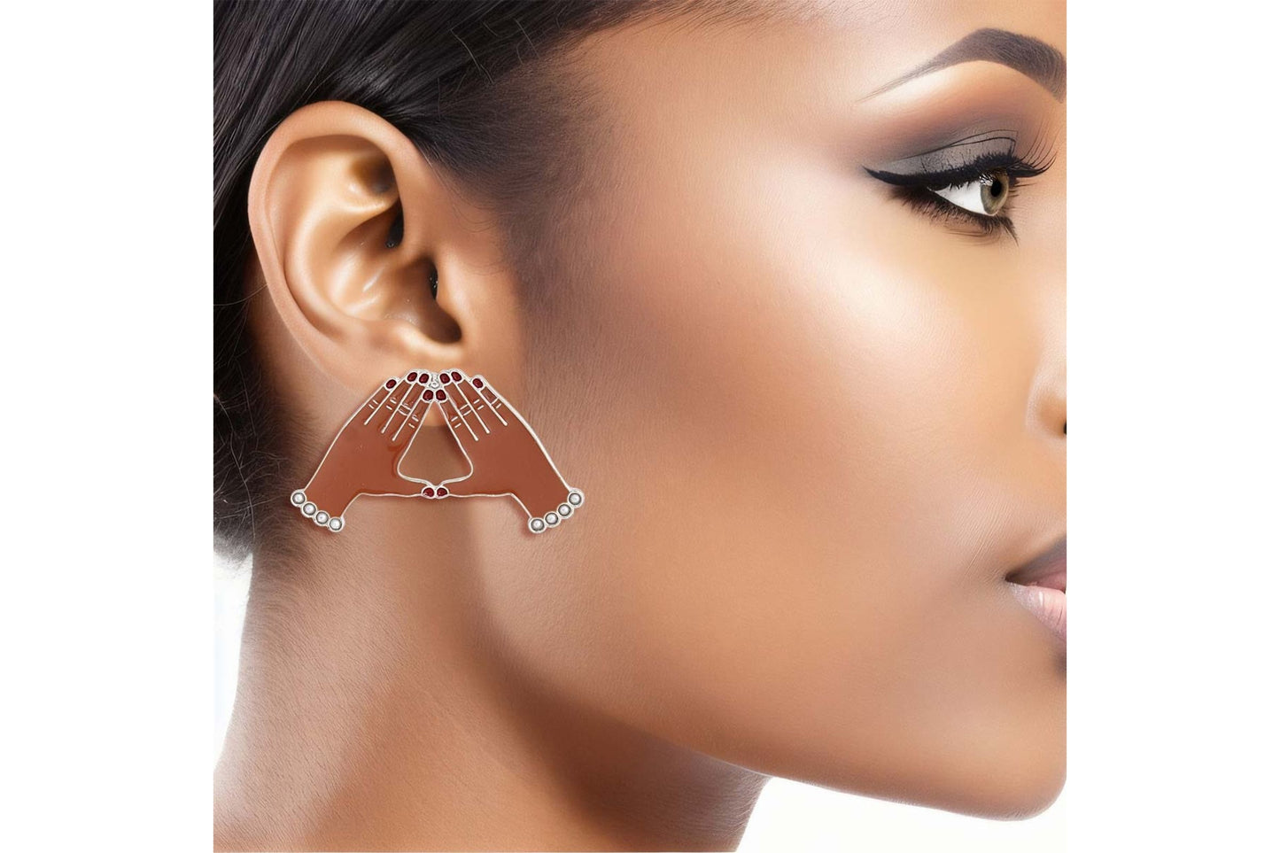 dst hand sign earrings shown.