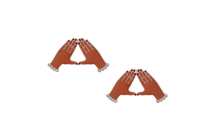 Pair of brown earrings shaped like hands on a white background