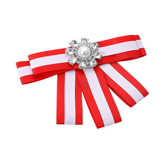 "A chic pink and green striped ribbon brooch/hair clip with a modern color-block bow design, adorned with glossy pearls and metallic accents. Perfect for sorority events, mixers, or everyday wear, it can be clipped onto hair, jackets, or bags for a stylish touch."